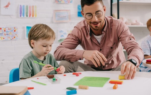 Therapist guiding a child through autism therapy activities near Stratford, CT